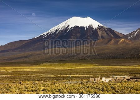 Parinacota Volcano And Moon - Altiplano In The Central Andes, Bolivia