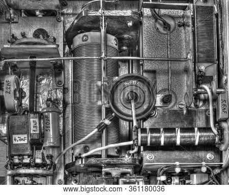 Inside View Of High Frequency Power Amplifier With Capacitors, Coils And Other Components In Black A