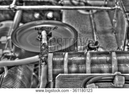 Inside View Of High Frequency Power Amplifier With Capacitors, Coils And Other Components In Black A