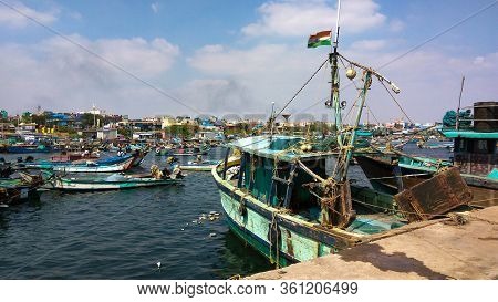 Royapuram, Tamil Nadu, India - January 01, 2019: Indian Fishing Boats With Men At Kasimedu Fishing H