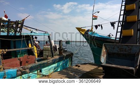 Royapuram, Tamil Nadu, India - January 01, 2019: Indian Fishing Boats With Men At Kasimedu Fishing H