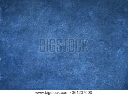 Dark Blue Grunge Background With Slightly Glowy Scratches.