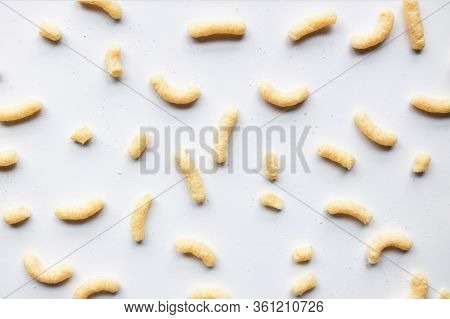 Sweet Corn Sticks Scattered On White Background Unorganized Close Up Front View