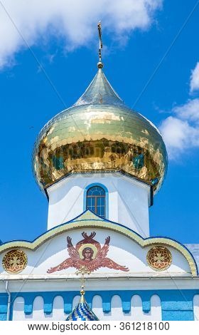 MUKACHEVO, UKRAINE JUNE 09, 2013:White church with gold domes a part of the European architecture. Russian orthodox church with typical onion domes. MUKACHEVO JUNE 09 2013 UKRAINE 