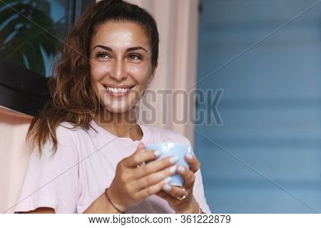 Relax Home, Self-care. Snug Happy, Smiling Girl Enjoying View Outside While Sit At Homish Cute Balco