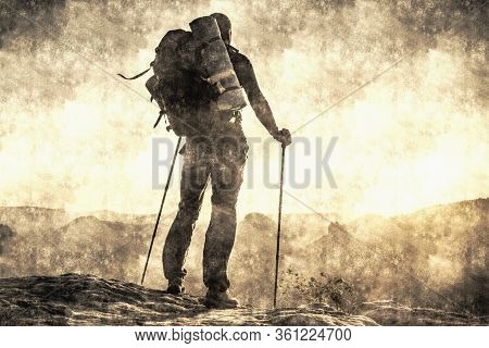 Tourist Traveler Man Makes Mountain Ascent Trip Summer With Backpack. Vacations In Nature Rue Outdoo