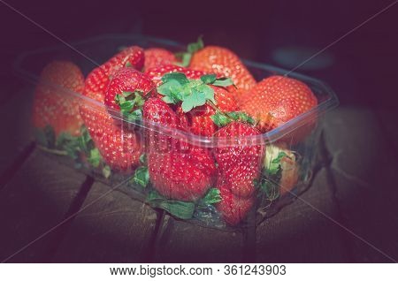 Strawberries In The Basket. Strawberries On The Table. Summer Strawberries In The Garden. Berries In