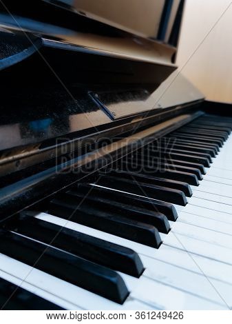 Old Black Piano Keys, Wooden Musical Instrument In Front View, Dusty Old Piano,black And White Keys 