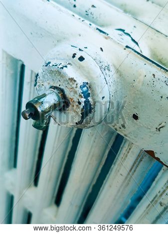 House Model Wrapped In Scarf On Radiator Indoors, Space For Text. Winter Heating Efficiency,winter, 
