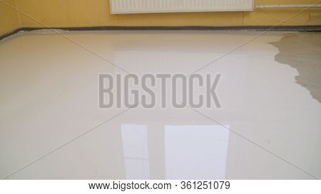 Floor Leveling. Filling The Floor With A Self-leveling Compound. Self-filling Floor