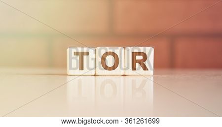 Tor Acronym Concept. Text On Wooden Cubes With Bright Light