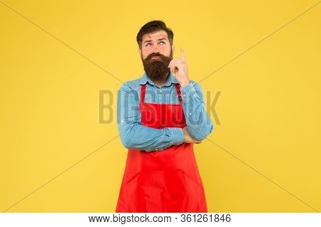 Hipster In Apron Thinking About Recipes. Easy To Cook Recipes. Unique Healthy Recipes. Plan Weekly M