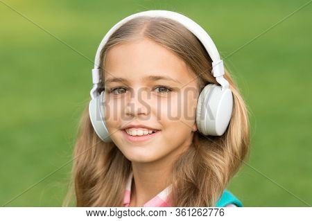 Never Stop E-learning. Happy Kid Listen To E-learning Course. Small Girl Study Online. E-learning In