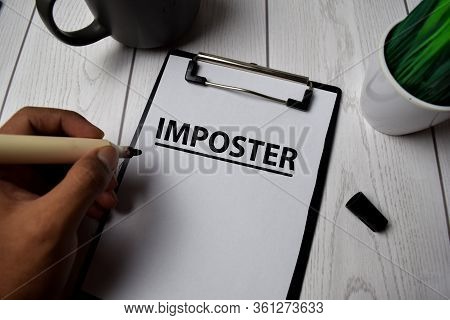 Imposter Write On Clipboard Isolated On Office Desk