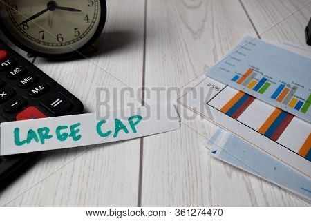 Large Cap Write On A Sticky Notes Isolated On Office Desk. Stock Market Concept