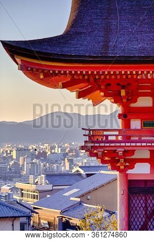 Japanese Heritage. One Of The Wings Of Kiyomizu-dera Temple Against Kyoto In Background. Vertical Im