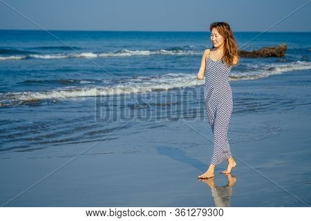 Happy Asian Armless Woman Smilimg At The Tropical Beach