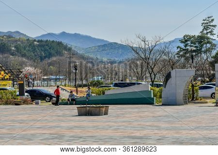 Hwanggan, South Korea; April 14, 2020: Three Unidentified People Talking While At No Gun Ri Peace Pa