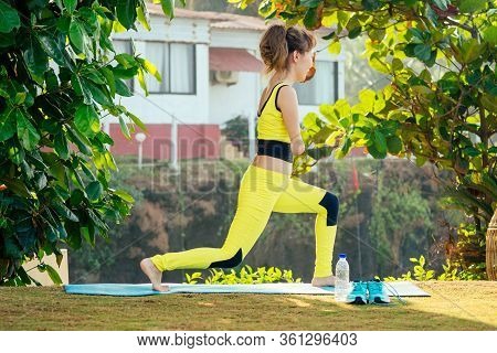 Happy Asian Armless Woman Warming Up Before Swimming At The Tropical Beach