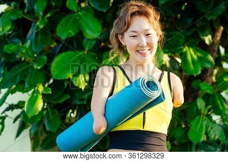 Happy Asian Armless Woman Warming Up Before Swimming At The Tropical Beach