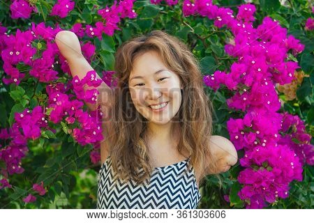 Happy Asian Armless Woman Smilimg At The Tropical Beach