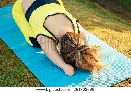 Happy Asian Armless Woman Warming Up Before Swimming At The Tropical Beach
