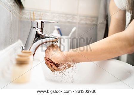Woman Washing Hands With Soap And Water In Clean Bathroom.decontamination Protocol,hand Hygiene Rout