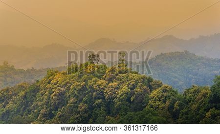 Tropical Forest With Mountains And Majestic Orange Sky And Clouds. Camping Site At Maewong National 