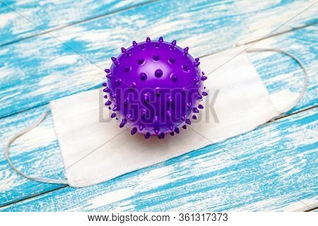 A Coronavirus Molecule Is Lying On A Medical Mask.the Concept Of Coronavrius Epidemic