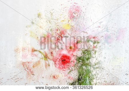 Beautiful Wallpeper Of A Flower Bouquet Standing Behind A Window Covered With Fresh Rain Drops