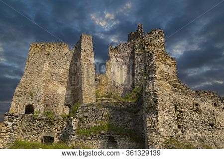 Scenic Ruins Of Ancient Castle  Likava Outside On Blue Cloudy Sky Background. Liptov Region. Slovaki