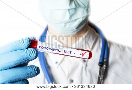 Positive Coronavirus Blood Test Concept. Analyzing Blood Sample In Test Tube For Coronavirus Test In