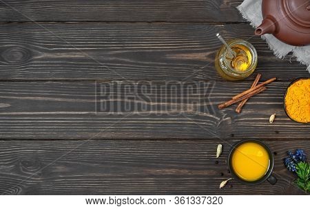 Cup Of Herbal Tea - Turmeric And Spices On Wooden Background. Ceramic Teapot With Tea And Bowl With 