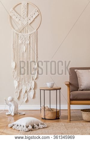 Interior Design Of Living Room With Stylish Brown Wooden Sofa, Macrame, Bookstand, Lamp, Coffee Tabl