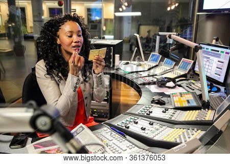 Johannesburg, South Africa - September 03, 2010: African Female Radio Dj Touching Up Make-up In Stud