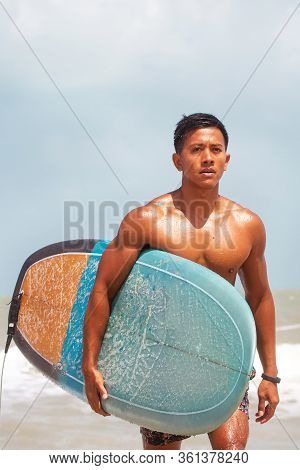 The Blurry Light Design Background Of Serfer Is Serfing On A Wave With Serf Board
