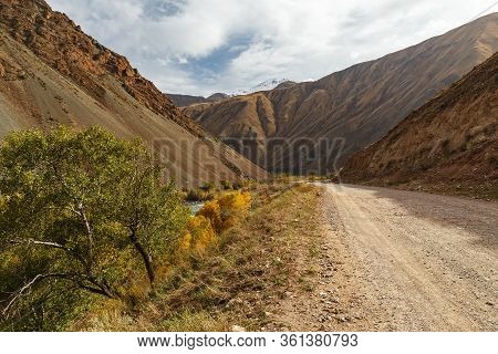 Mountain Road Along The Kokemeren River In Naryn Region Of Kyrgyzstan.