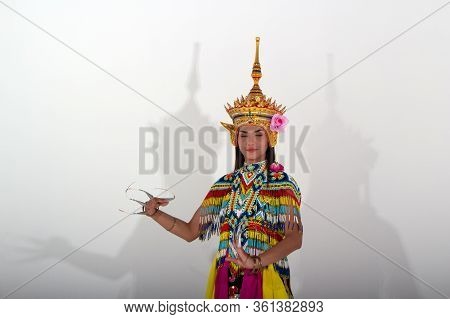 The Beautiful Woman Wearing Thai Tradition Southern Costume And Put Headdress On Her Head,standing O