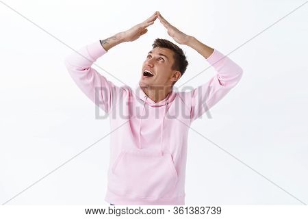 Stay Home, Self Quarantine Concept. Portrait Of Funny Handsome Blond Boyfriend In Pink Hoodie, Maiki