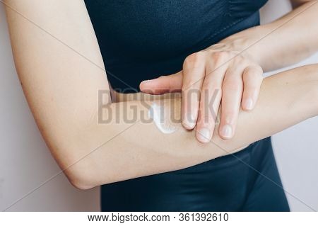 Close-up View Of Woman Applying Sunscreen Lotion On Her Body For Protect Her Skin From Sunlight. Sun