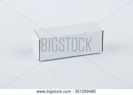 Close Up Of A Small White Cardboard Box , Isolated On White Background