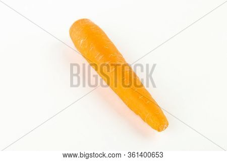 Human Hand Holding A Fresh Carrot. Fre Copy Space.