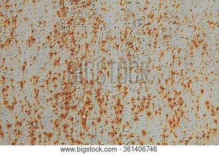 Metallic Wall Background, Texture. An Old Grey And Rusty Surface With Faded Uneven Colour. Abstract 