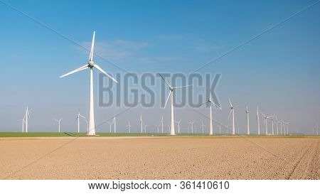 Windmill Park Westermeerdijk Netherlands, Wind Mill Turbine With Blue Sky In Ocean, Green Energy