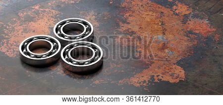 Ball Bearings, On Metal Rusty Background. Auto Service Concept. 3D Illustration