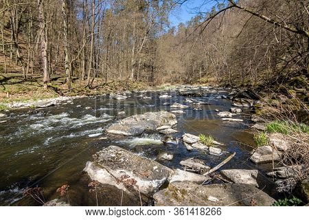 River With Stones Under Blue Sky In Spring Landscape. Oslava River, Czech Republic, Europe