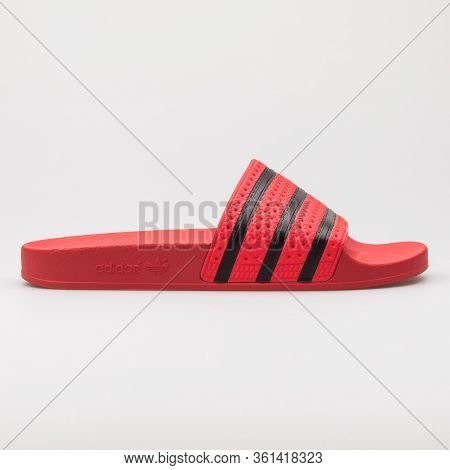 Vienna, Austria - August 24, 2017: Adidas Aqua Slides Red And Black Sandals On White Background.