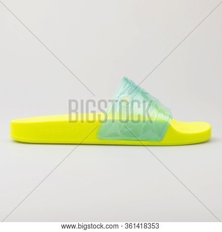 Vienna, Austria - August 24, 2017: Adidas Aqua Slides Yellow And Green Sandals On White Background.