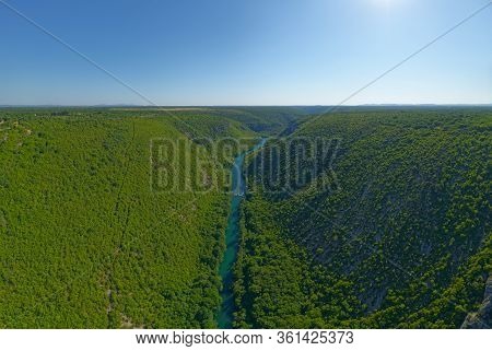 Krka River, Aerial View From The Middle Of The Canyon And Waterfall Located In Promina County At Dal