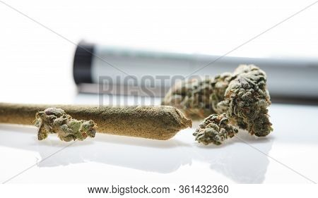 Alternative Medicine Rolled Joint With Marijuana Cbd Buds On White Background